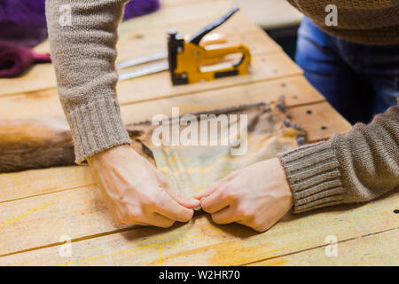 Skinner working with mink fur skin Stock Photo