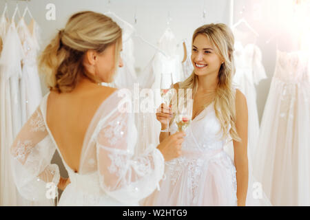 Beautiful woman proposing a toast to her friend. Stock Photo