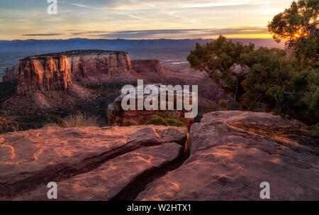Rock formations flow in the morning sunlight along the overlook at Colorado National Monument located in Grand Junction, Colorado Stock Photo