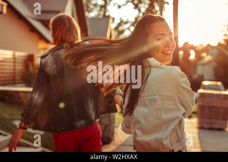 Attractive long-haired woman being in playful mood Stock Photo