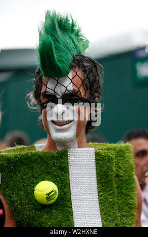 London, UK. 8th July, 2019. Photo taken on July 8, 2019 shows a spectator dressed up with tennis court decorations at the 2019 Wimbledon Tennis Championships in London, Britain. Credit: Han Yan/Xinhua/Alamy Live News Stock Photo