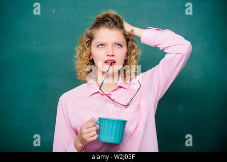 energy and vigor. energy charge. idea and inspiration. school teacher need coffee break. good morning. girl refreshing with tea drink. tired woman with coffee cup at blackboard. Just relaxing. Stock Photo