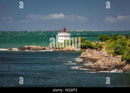 New Zealand coast with distant lighthouse at Bluff, New Zealand. Stock Photo