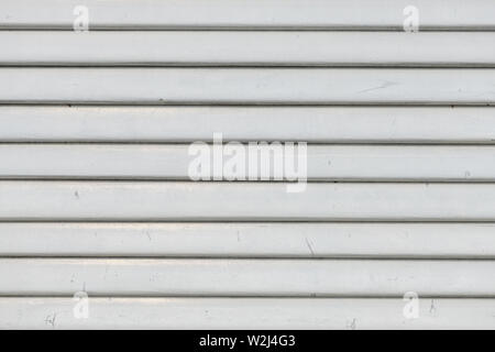 White vintage wooden boards in overlap cladding pattern, front view as copy space or graphic design background Stock Photo