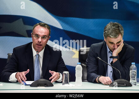 Athen, Greece. 09th July, 2019. The new Greek Finance Minister Christos Staikouras (l) speaks at the handover in the Ministry of Finance next to his predecessor Euklid Tsakalotos. Credit: Angelos Tzortzinis/dpa/Alamy Live News Stock Photo
