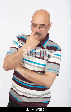 Portrait of a man adjusting his eyeglasses