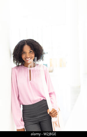 Young pretty African-american employee looking at camera Stock Photo