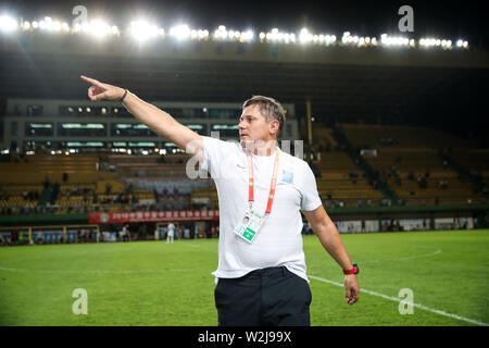 Head coach Dragan Stojkovic of Guangzhou R&F celebrates as he watches his players scoring against Chongqing SWM in their 16th round match during the 2019 Chinese Football Association Super League (CSL) in Guangzhou city, south China's Guangdong province, 6 July 2019. Guangzhou R&F defeated Chongqing SWM 4-2. Stock Photo
