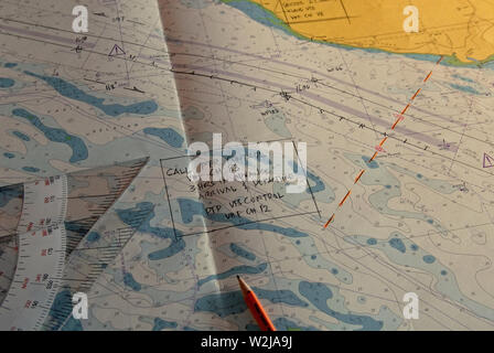 malacca strait, september 02, 2006: a navigational triangle and a pencil on the british admiralty chart 1358  one fathom bank  to singapore straits on Stock Photo