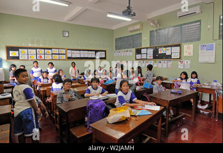 jakarta,  indonesia - november 18, 2009: pupils in their classroom at sdn menteng 01 elementary school which barack obama  attended under the name of Stock Photo