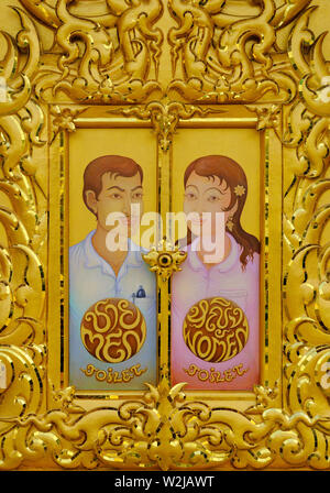 chiang rai, thailand - november 02, 2009: a golden decorative  toilet entrance door at wat rong khun Stock Photo