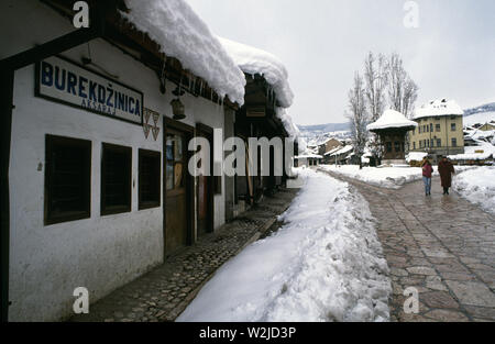 28th March 1993 During the Siege of Sarajevo: closed-up shops in Bascarsija Square in the old town. In the background is is the Sebilj Public Fountain. Stock Photo