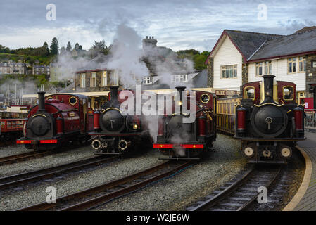 line up of four maroon steam locomotives at Porthmadog harbour station on Ffestiniog Railway, Wales Victorian Weekend 2018 Stock Photo