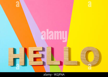 Word Hello lined with wooden letters on multicolor background Stock Photo