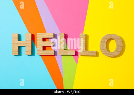 Word Hello lined with wooden letters on multicolor background Stock Photo