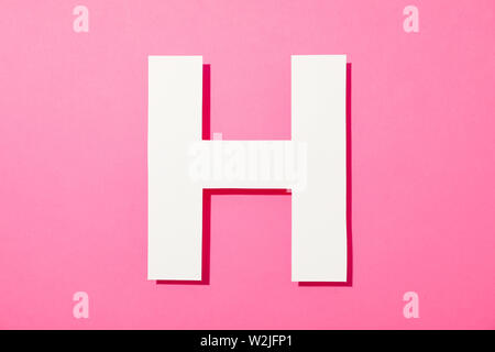 White letter H on color background, space for text Stock Photo