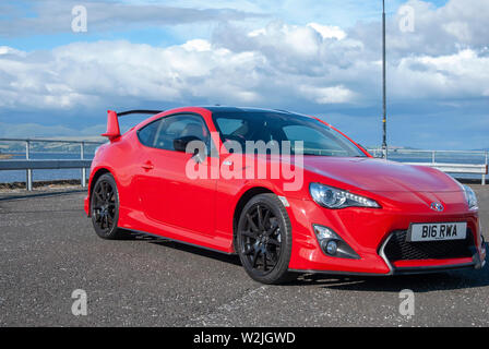 2015 Model Bright Red Toyota GT 86 Aero Sports Car front right hand drivers side offside view of 2 two door rhd right hand drive bright red toyota gt Stock Photo