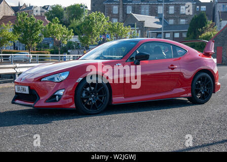 2015 Model Bright Red Toyota GT 86 Aero Sports Car front left hand passengers side view of 2 two door rhd right hand drive bright red toyota g Stock Photo