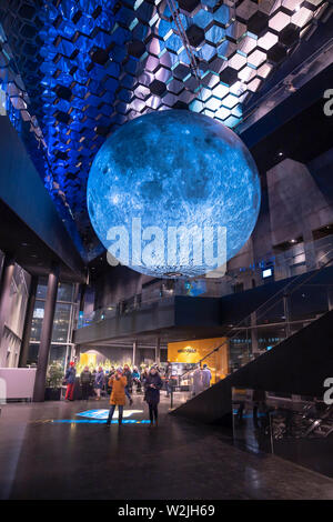 Museum of the Moon, art piece, by Installation artist Luke Jerram during The Winter Lights Festival, Harpa, Reykjavik, Iceland. Stock Photo