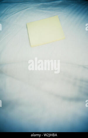 Sticky notes on bed Stock Photo