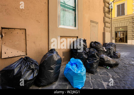 Rome, Italy - July 3, 2019: the garbage emergency in rome involve even the popular luxury area via Condotti Stock Photo