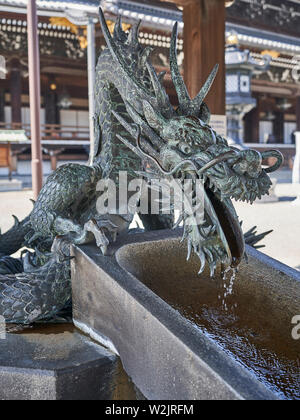 A dragon supplying water at purification fountain of Higashi Hongan-ji in Kyoto, Japan. Stock Photo