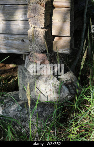 Stone foundation (a padstone) of an old abandoned farmhouse in Ylöjärvi, Finland Stock Photo