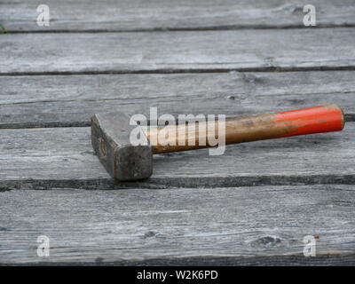 sledgehammer on the boards old bridge close to Stock Photo