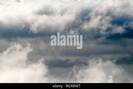 Dark stormy rain clouds in the sky. Dramatic rain cloud background without land, bad weather Stock Photo