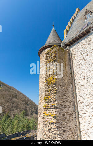 Vianden castle tower  with bricks covered in green moss, Luxembourg Stock Photo