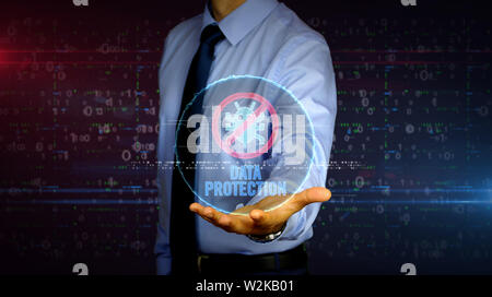 Man with antivirus data protection symbol hologram on hand. Businessman showing futuristic concept of digital protection, firewall and computer safety Stock Photo