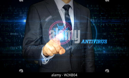 A businessman in suit touch the screen with antivirus symbol hologram. Man using virtual interface. Firewall, computer protection, online safety and c Stock Photo