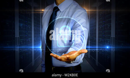 Man with dynamic cyber security and padlock symbol hologram on hand. Businessman showing futuristic concept of digital protection, firewall and comput Stock Photo