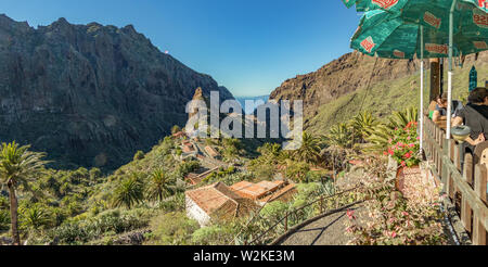 Masca, Tenerife, Spain - November 25, 2018: Cozy mountain village in deep canyon with jungle forest on a paradise island. Beautiful golden hour of war Stock Photo