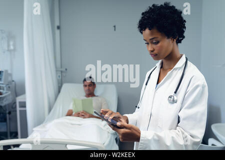 Female doctor using digital tablet in the ward Stock Photo