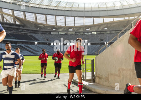 Male rugby players returning the dressing room after the match Stock Photo