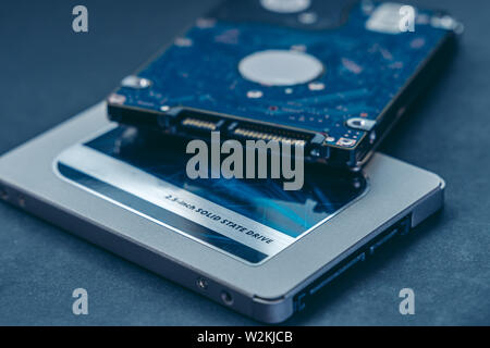 SSD drive and 2.5 HDD drive. Solid State Drive vs traditional HDD, isolated. Fast storage device vs slow. Stock Photo
