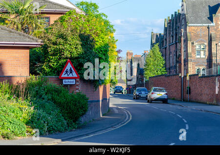 The picture of a street with brick houses in small English town called Stone, Staffordshire. The road sign architecture, beautiful, blue, bricks, buil Stock Photo