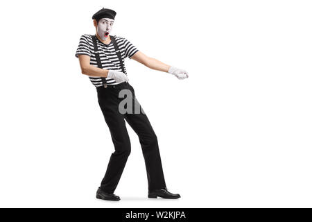 Pantomime man pulling a rope isolated on white background Stock Photo ...