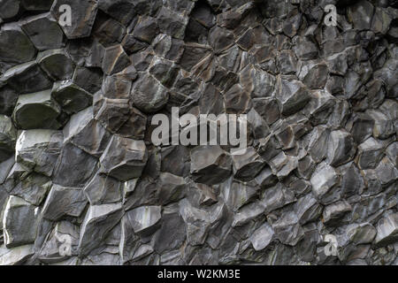 Close up view of hexagonal basalt columns on Reynisfjara black sand beach, southern Iceland. Stock Photo