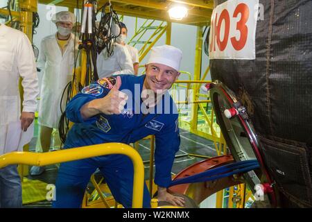 International Space Station Expedition 60 prime crew member Drew Morgan of NASA gives the thumbs up as he boards the Soyuz spacecraft simulator at the Baikonur Cosmodrome July 5, 2019 in Baikonur, Kazakhstan. Morgan, Skvotsov and Parmitano are expected to launch July 20th on the Soyuz MS-13 spacecraft to the International Space Station. Stock Photo