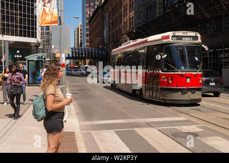 Toronto, Canada - 22 June 2019: Street car in Downtown Toronto going on College street Stock Photo