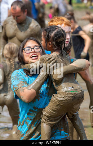 Westland, Michigan - Children age 12 and younger, along with some parents, play in the mud during the annual 'Youth Mud Day' organized by Wayne County Stock Photo