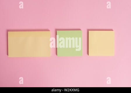 Close up front view three multicolor blank notepads colored background Stock Photo