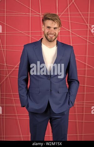 Manager confident wear perfect outfit. Guy office worker handsome appearance. Guy unshaved office manager. Manager dress code. Man well groomed manager wear elegant formal suit pink background. Stock Photo