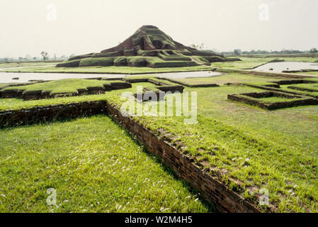 Paharpur Buddhist Monastery, a tourist attraction of North Bengal was established by King Dharma Pal in 7th century. Located in Paharpur village 5 km. west of Jamalganj in the greater Rajshahi district, this 7th century archaeological find covers approximately an area of 27 acres of land. The main temple is in the center of the Monastery. The architecture of the pyramidal cruciform temple is profoundly influenced by those of South-East Asia, especially Myanmar and Java. It is a UNESCO World Heritage site. Bangladesh. 1997. Stock Photo