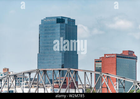 Little Rock, USA - June 4, 2019: Capital city in Arkansas cityscape with bridge and signs for company business and hotel for Marriott and Stephens Inc Stock Photo
