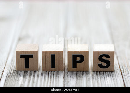 Tips word written on wooden cubes Stock Photo