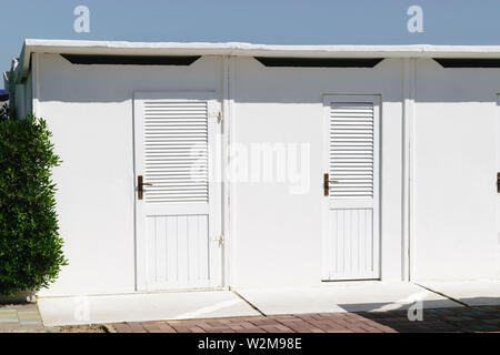 White color beach huts in Rimini beach resort, Italy Stock Photo