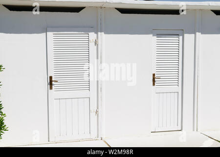 White color beach huts in Rimini beach resort, Italy Stock Photo